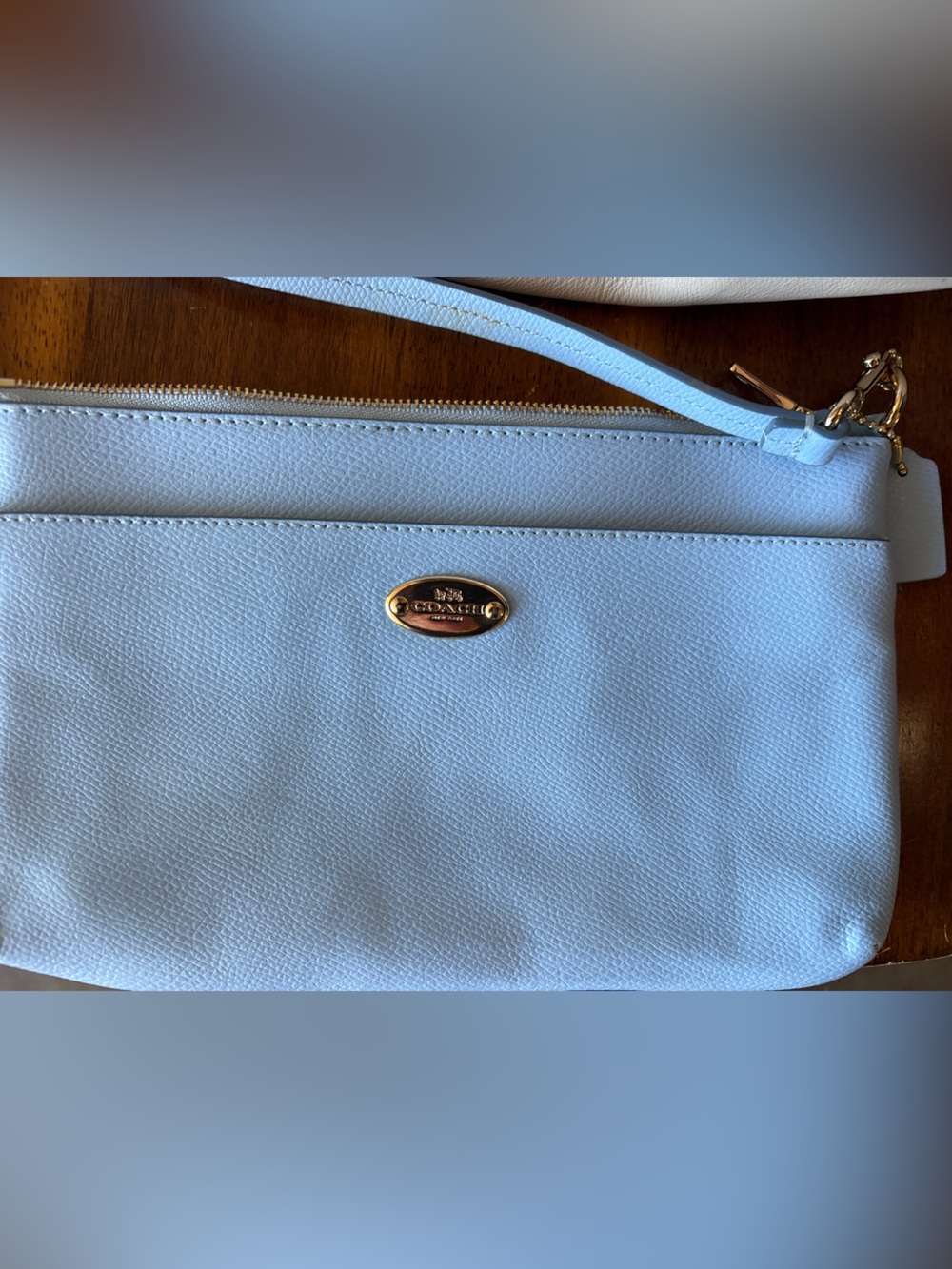 Coach Pale Blue Leather Wristlet with Gold Accent